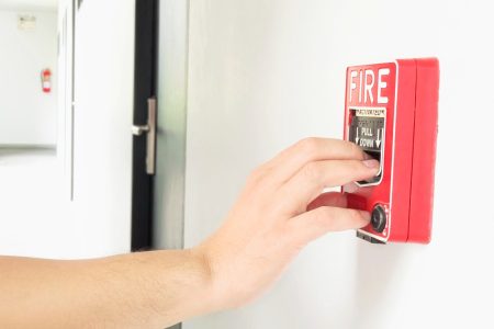 Activating a fire alarm hand station by Cubic Smart Alarms.