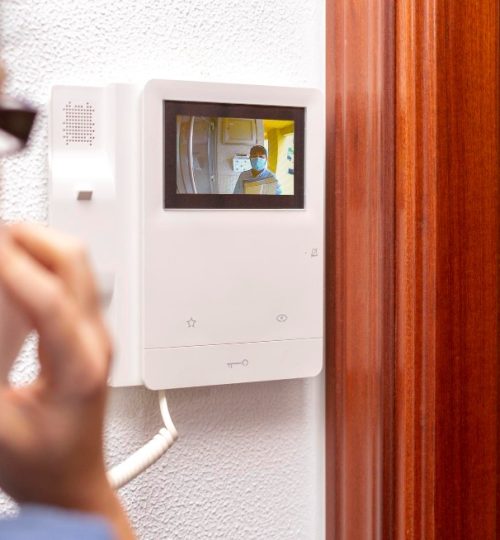 messenger-touches-intercom-woman-checks-through-screen